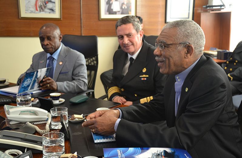 President David Granger makes a point at a meeting on maritime zone and environmental management at the Complex of Technical Maritime as Rear Admiral Osvaldo Schwarzenberg  and Minister Carl Greenidge listen keenly.