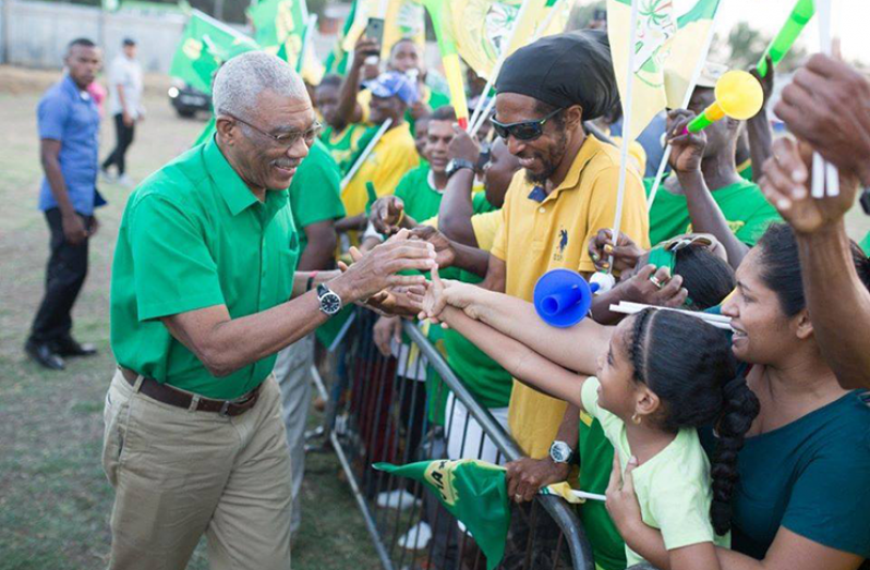 President David Granger greets supporters at the rally