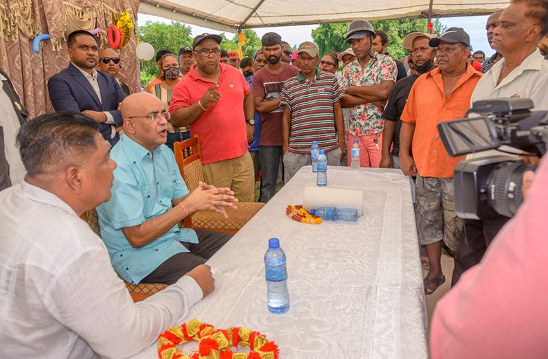 Vice-President, Dr. Bharrat Jagdeo and other senior officials address the concerns of fisherfolk at the Unity Community Centre Ground (Delano Williams photo)