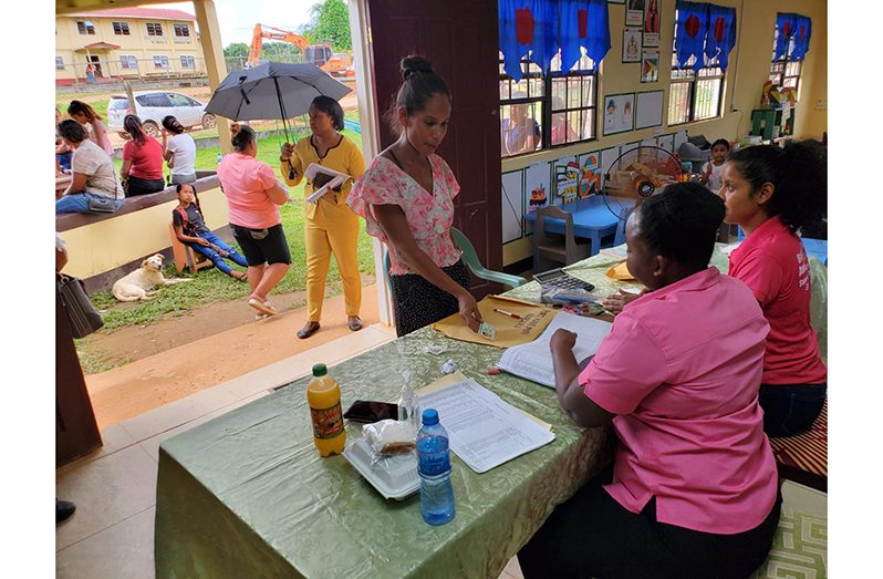 A parent counts the money shortly after collecting it