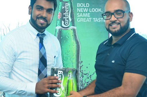 CEO of Southland International Inc, Irzad Zamal and Owner of Gravity Lounge Navin Singh during a symbolic handing over of Carlsberg Beer, the official beer of all events.