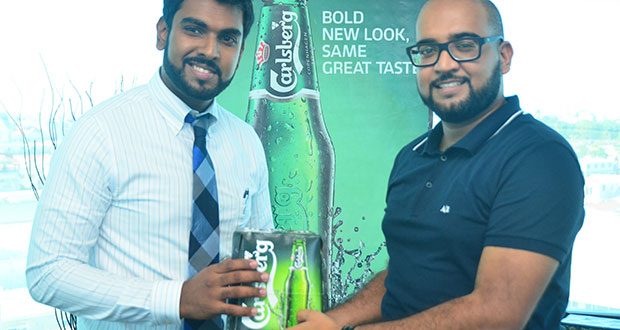 CEO of Southland International Inc, Irzad Zamal and Owner of Gravity Lounge Navin Singh during a symbolic handing over of Carlsberg Beer, the official beer of all events.