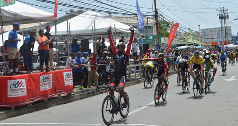 Guyanese Geron Williams (second left) trails his Team Foundation teammate Noriandy Sanchez of the Dominican Republic across the finish line during the fourth stage of the Tobago Cycling Classic.