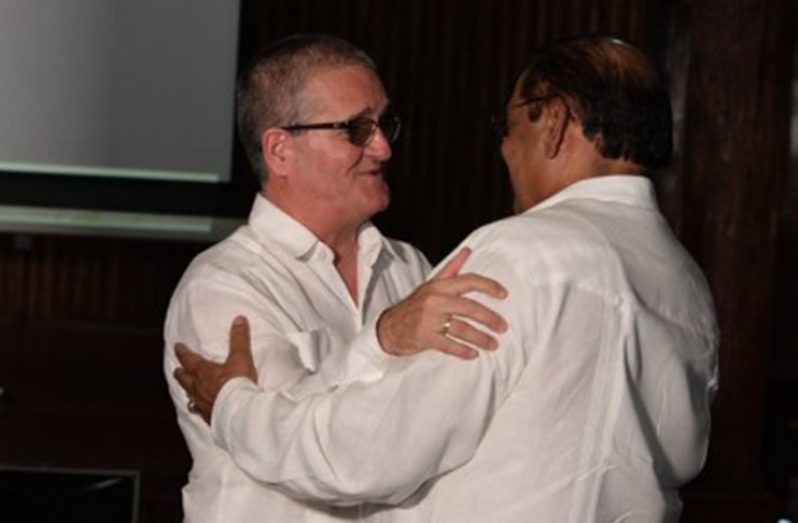 Cuban Ambassador to Guyana, Julio Cesar Gonzalez Marchante greets Prime Minister Moses Nagamootoo