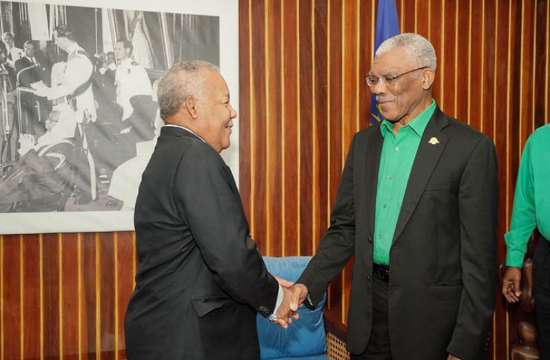 President David Granger (right) greets Head of the Commonwealth Observer Mission and former Prime Minister of Barbados, Mr. Owen Arthur (left) at the Ministry of the Presidency(Ministry of the Presidency photo)