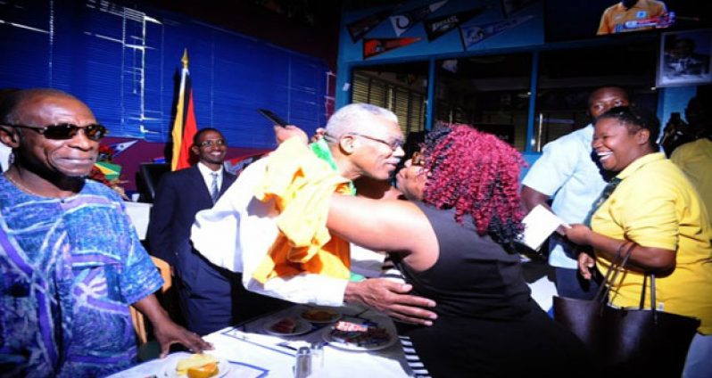 President David Granger being greeted by one of his supporters at Bubbas Sports Bar (Barbados Daily)