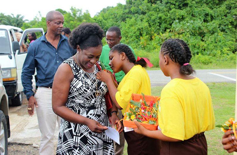 Minister within the Ministry of Education, Nicolette Henry, being greeted on her arrival at the New Opportunity Corps