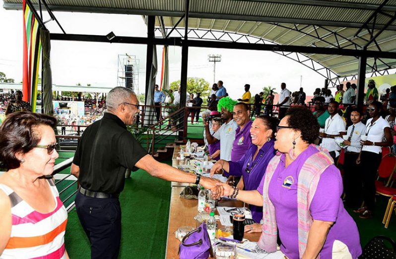 President David Granger and First Lady Sandra Granger greeting the float parade judging panel (Ministry of the Presidency photo)  