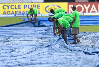 Ground-staff engage in mop-up operations during last Friday’s rain-affected opening ODI. (Photo courtesy CWI Media)