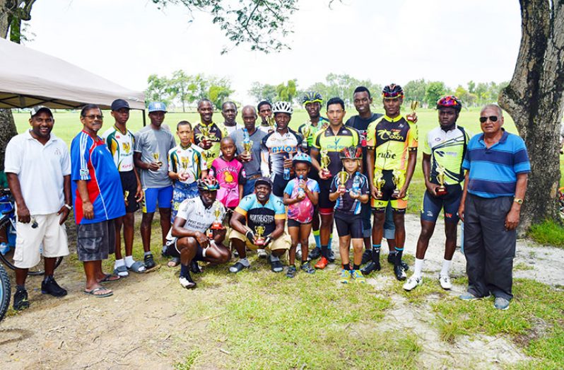 Prize winners of the various categories of the DDL sponsored 11-race cycle race programme strike a pose after receiving their trophies and cash prizes.(Cullen Bess-Nelson photo)