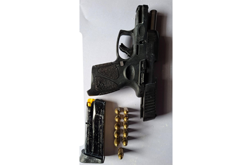 The gun and ammunition that were found by the police on Friday (GPF photo)