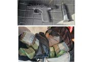 The firearm and cash seized during an  inter-agency operation