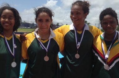 Double gold medallist Britany van Lange (third from left) with the other members of the Guyana Girls relay team. From left are Soroya Simmons, Accalia Khan and Jamila Sanmoogan.