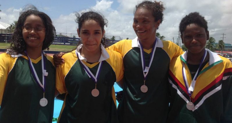 Double gold medallist Britany van Lange (third from left) with the other members of the Guyana Girls relay team. From left are Soroya Simmons, Accalia Khan and Jamila Sanmoogan.