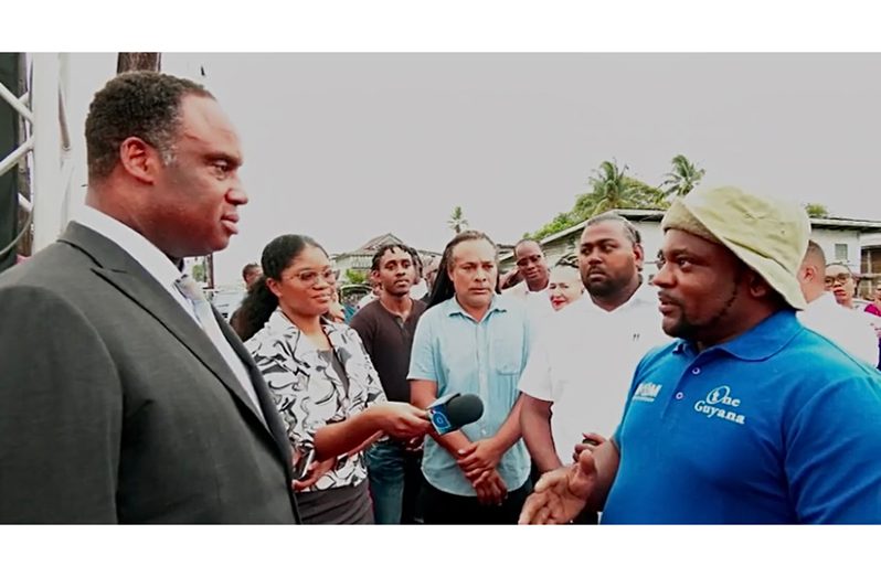 US Congressman, Jonathan Jackson, interacting with residents of Georgetown
