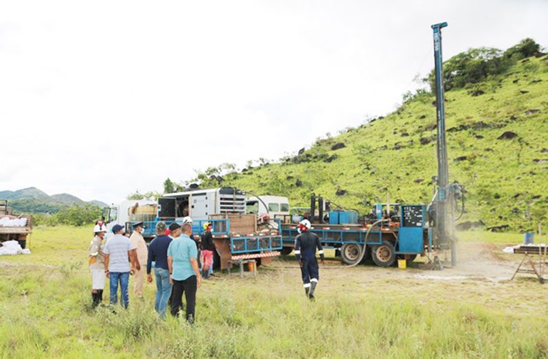 Minister of Housing and Water, Collin Croal and team inspecting the well being drilled at Toka, Region Nine (DPI PHOTO)