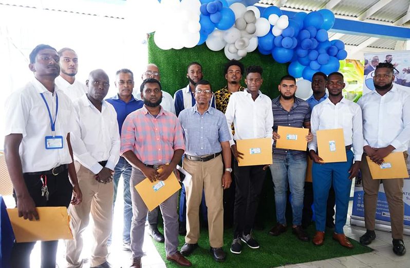 CEO of GWI, Shaik Baksh (centre), with the Plant Operators who completed the training