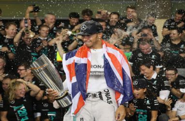 ABU DHABI, UNITED ARAB EMIRATES - NOVEMBER 23: Lewis Hamilton of Great Britain and Mercedes GP celebrates with his team after winning the World Championship after the Abu Dhabi Formula One Grand Prix at Yas Marina Circuit, yesterday. (Photo by Clive Mason/Getty Image