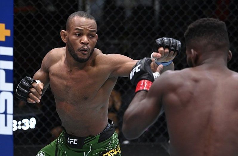 Guyana's Carlston Harris about to land another punch against Impa Kasanganay during their welterweight fight at the UFC Fight Night event on September 18, 2021 in Las Vegas, Nevada. (Photo by Jeff Bottari/Zuffa LLC)