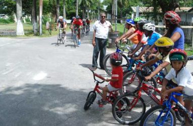 National cycle coach Hassan Mohamed (standing) is caught by photographer Cullen Bess-Nelson explaining the basics of the art of riding to the newcomers while at left, seasoned cyclists are seen putting mileage in their legs.
