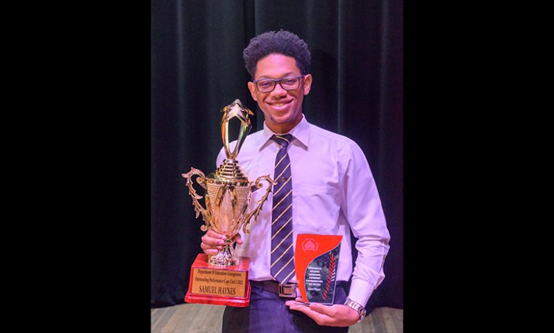 2021 CAPE top performer, Samuel Haynes with his awards (Delano Williams photo)