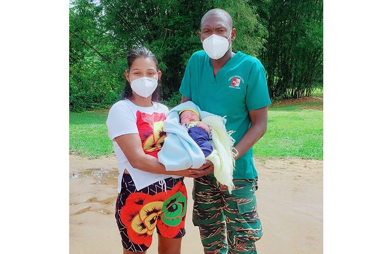 CPL Sabola is seen with Ms Diaz and her newborn