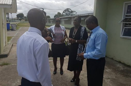 Minister within the Ministry of Education, Nicolette Henry, and other officials during the school visits