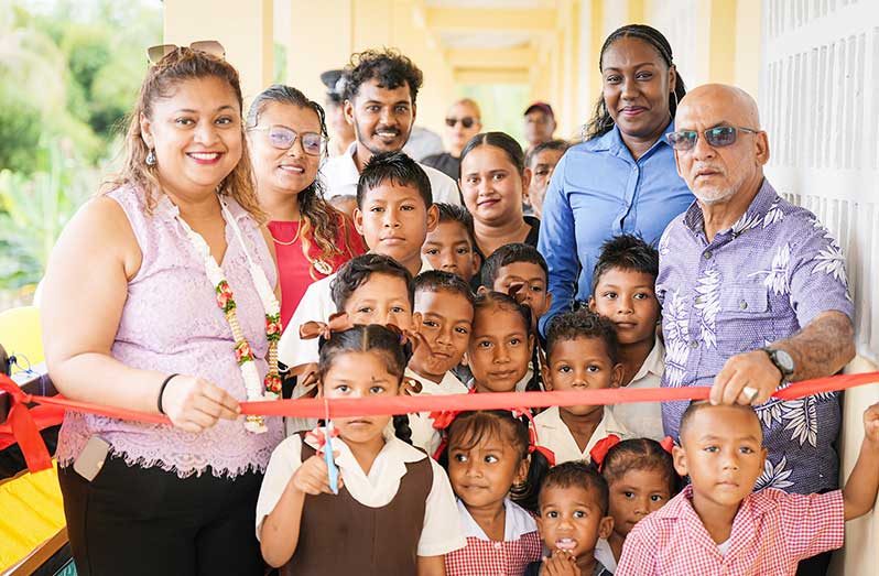 Minister of Education, Priya Manickchand (left) with other officials and students of the Western Hogg Island Primary School
MOE Photo