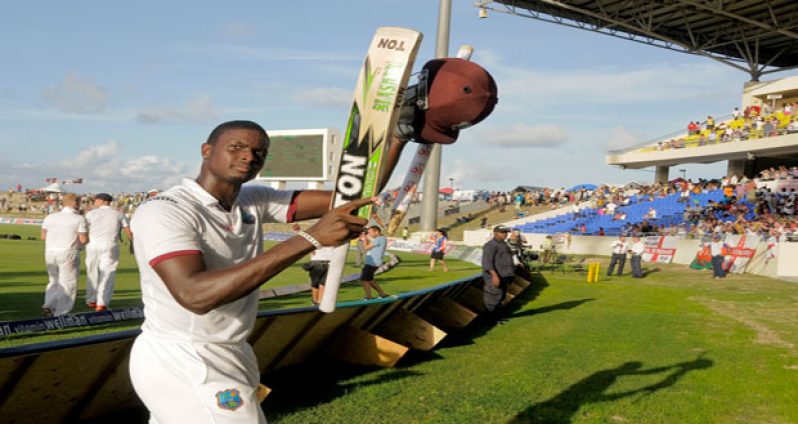 Jason Holder salutes fans on the final day of the drawn first Test between West Indies and England on Friday after completing his maiden unbeaten century to save the West Indies from defeat.
(Photo by WICB Media/Randy Brooks of Brooks Latouche Photography).