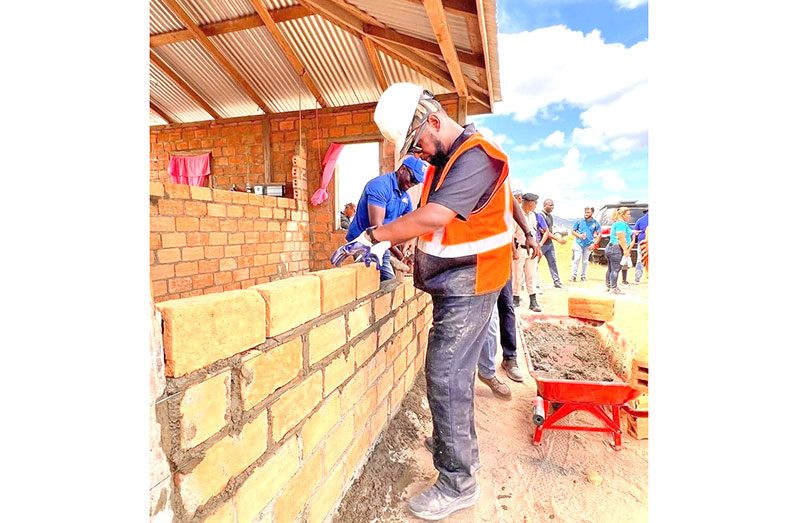 President Dr. Irfaan Ali and Prime Minister Brigadier (Ret’d) Mark Phillips, joined a multi-stakeholder team on Friday to commence rebuilding efforts of several homes in Karasabai