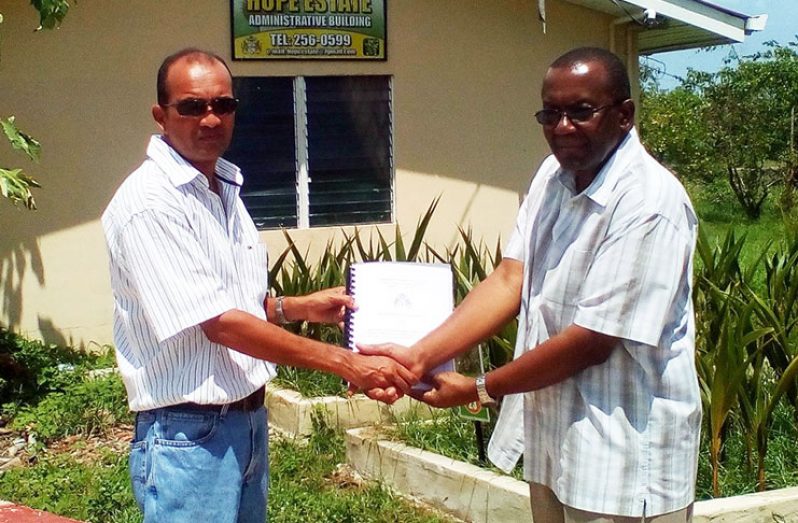 Ricky Roopchand, General Manager, Hope Estate (left) and the contractor, Mr. Ivor Allen