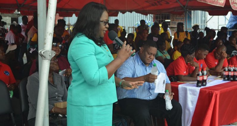 Minister in the Ministry of Public Health, Dr Karen Cummings, addressing attendees at the health fair at the Mackenzie car park