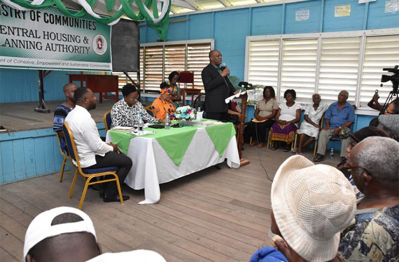 Director-General of the Ministry of the Presidency, Mr. Joseph Harmon, addresses new land-title holders at the Berbice Educational Institute, New Amsterdam. Also photographed are [from left] Deputy Mayor of New Amsterdam, Mr. Wainwright McIntosh; Chief Executive Officer (CEO) of the Central Housing and Planning Authority (CH&PA), Mr. Lelon Saul; Minister within the Ministry of Communities, Ms. Annette Ferguson and Regional Executive Officer, East Berbice-Corentyne (Region Six), Ms. Kim Williams-Stephen