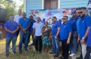 MOM handing over the new house to Diwanti Sirpat, a pensioner of Number 60 Village, Corentyne