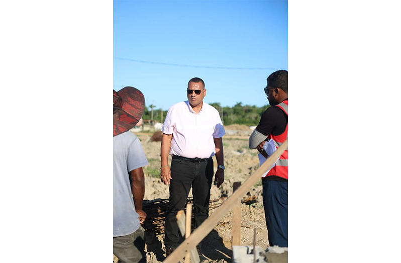 Minister of Housing Collin Croal engages contractors at Le Reconnaissance
