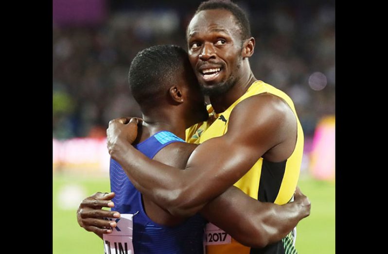 Usain Bolt of Jamaica hugs Justin Gatlin of the United
States following Gatlin’s win in the men’s 100 metres
final. Photograph: Michael Steele/Getty ...