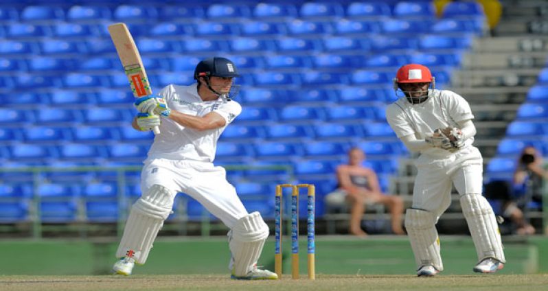 St. Kitts Invitational XI wicketkeeper Jason Peters looks on as England’s opener and skipper Alistair Cook cuts this delivery during his unbeaten innings yesterday. (Photo courtesy WICB Media/Randy Brooks of Brooks LaTouche Photography)