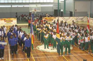 Let the Games Begin! Teams from French Guiana (left), Guyana (centre) and Suriname at the Cliff Anderson Sports Hall during the opening of the Inter-Guiana Games yesterday.(Sonell Nelson photo)