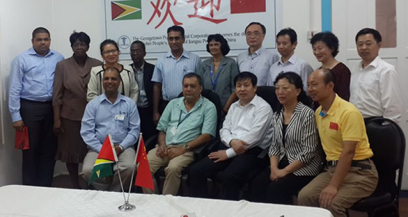 At centre is CEO of GPHC, Mr Michael Khan, with executives of the GPHC (at left) and health executives from the Subei People’s Hospital.