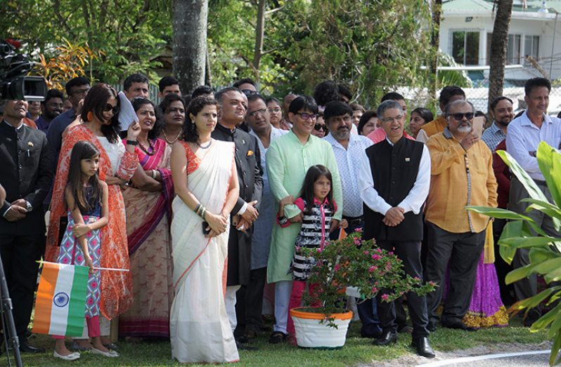 India’s High Commissioner to Guyana Dr. K. J. Srinivasa (left) looks on as the national flag of India is hoisted during celebrations here of his country’s 70th Republic Anniversary