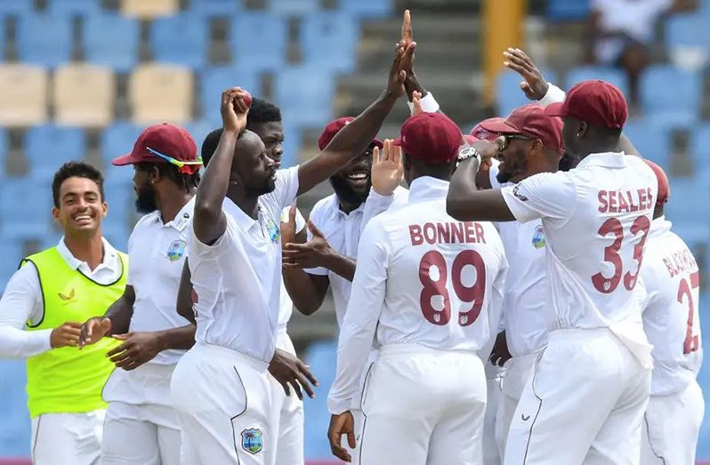 West Indies share in Kemar Roach's joy at securing 250 Test wickets•Jun 25, 2022•Randy Brooks/AFP via Getty Images