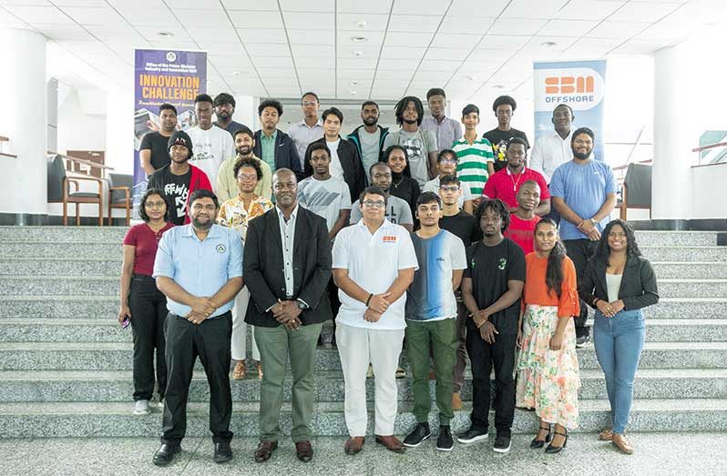 From left at front: Director IIU, Shahrukh Hussain; Permanent Secretary of OPM, Dr. Alfred King, and General Manager SBM Offshore, Martin Cheong, with participants of this year’s Innovation Challenge (Delano Williams Photo)