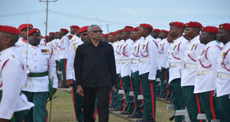 Commander-in-Chief of the Armed Forces, His Excellency President David Granger inspects the guards on the field