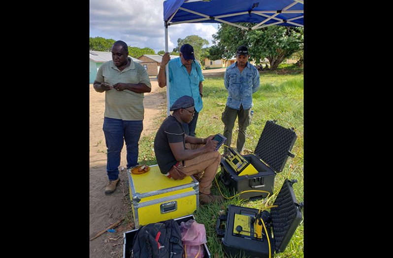 Water Resources Manager, Orin Browne, conducted one aspect of the resistivity logging while Dr. Richard Van-West Charles and other GWI officials look on 