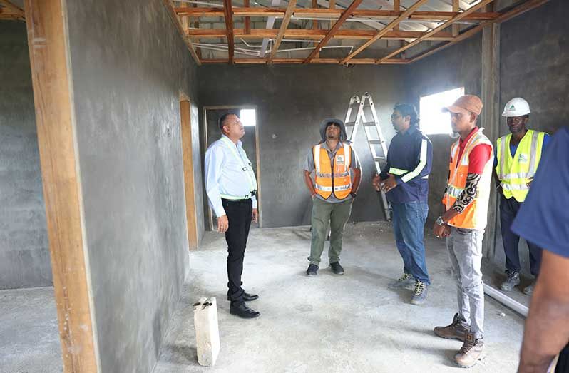 Minister of Housing and Water, Collin Croal, visited the construction site to engage with several contractors involved in the project