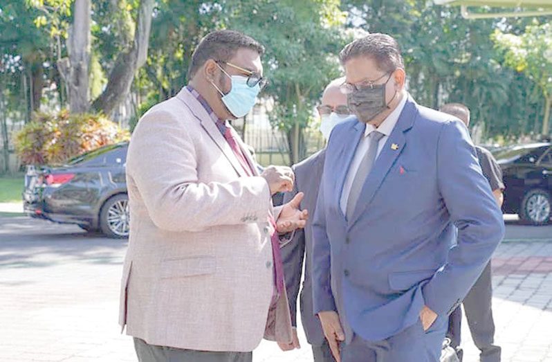 President, Dr Irfaan Ali interacts with President of Suriname, Chandrikapersad Santokhi during the latter’s last visit to Guyana