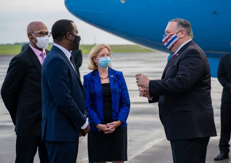 US Secretary of State, Michael Pompeo, speaks with Minister of Foreign Affairs and International Cooperation, Hugh Todd as US Ambassador, Sarah-Ann-Lynch pays keen attention (DPI photo)