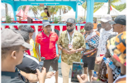 President Irfaan Ali interacting with racers at the Lake Mainstay Regatta held recently (DPI photo)