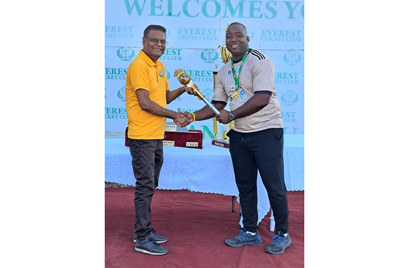 DCC Captain Jamal Hinkson is presented with the Parliamentary Mace from Speaker of the House Mansoor Nadir