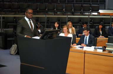 Benn delivering a speech at the Moot Court held at the Summer Academy during his ITLOS training